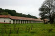 La Purisima Mission exterior arcade against its pasture setting. Lompoc, CA.