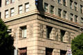 Row of carved California figures on Washington Mutual Building. Los Angeles, CA.