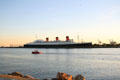 Queen Mary in profile from Long Beach park. Long Beach, CA.