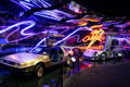 Neon artwork over DeLorean DMC12 & Mercedes Benz McLaren SLR at Petersen Automotive Museum. Los Angeles, CA.