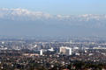 Skyline of Torrance & Mobil refinery area of Los Angeles against San Gabriel Mountains from Rancho Palos Verdes. Los Angeles, CA.