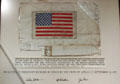 American flag from back of life support system worn on the moon signed by Apollo 15 astronauts at Nixon Library. Yorba Linda, CA.