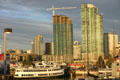 Two green The Grande towers from Midway dock with Lord Hornblower ship. San Diego, CA.