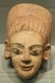 Etruscan terracotta antefix roof ornament with female head from Caere at Getty Museum Villa. Malibu, CA.