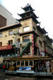Cable car crosses Grant Ave. in Chinatown. San Francisco, CA.