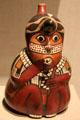 Nazca earthenware stirrup vessel in form of ceremonial figure from Peru at de Young Museum. San Francisco, CA.