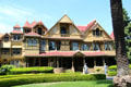 Winchester House ended up with 160 rooms because Sarah Winchester believed that continual building was only way of escaping ghosts killed by her husband's rifles. San Jose, CA.