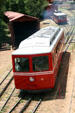 Pike's Peak Cog Railway diesel car starts climb to top of mountain. Manitou Springs, CO.