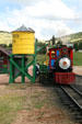 Cripple Creek Railroad steam locomotive #2 beside water tower. Cripple Creek, CO.