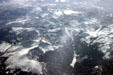 Snow-covered Rocky Mountains & valleys from air. CO.