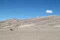 Visitors on burning sands of Great Sand Dunes National Park. CO.