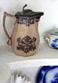 Pitcher with lid with brown design at Oliver Ellsworth Homestead Museum. Windsor, CT.