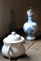 White posset pot for mix of curdled milk & wine beside ewer painted with peacock both from England at Buttolph-Williams House. Wethersfield, CT.
