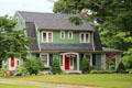 Green house with hip roof. Haddam, CT.