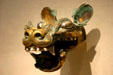 Bronze, silver, gold chariot fitting in canine shape from China in Sackler Gallery. Washington, DC.