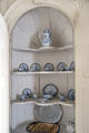 Corner cabinet with porcelain coffee service at Old Stone House. Washington, DC.