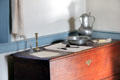 Pewter basin & pitcher on chest at Old Stone House. Washington, DC.