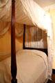 Mahogany "rice bed" bedstead made in Charleston draped in mosquito tenting pavilion n South Carolina period bedchamber at DAR Memorial Continental Hall. Washington, DC.