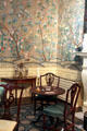 Card & side tables under reproduction Chinese-style hand painted wallpaper in New York period parlor at DAR Memorial Continental Hall. Washington, DC.