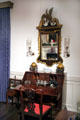 Block front desk with pigeon holes & drawers from Salem or Boston under reproduction American looking glass in Indiana period parlor at DAR Memorial Continental Hall. Washington, DC.