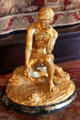 Bronze statuette lighting cigar from volcano represents character in children's book written by Isabel Anderson at Anderson House Museum. Washington, DC.