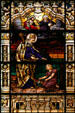 Stained glass window of St Augustine by the sea talking to a child in Cathedral. St Augustine, FL.