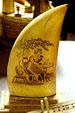 Whales-tooth scrimshaw etched with woman reading at Lightner Museum. St Augustine, FL.