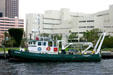 Broward County Jail over working boat on New River. Fort Lauderdale, FL.