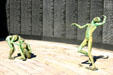 Skeletal statues in front of wall with names of victims at Holocaust Memorial. Miami Beach, FL.