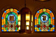 Jewish symbols on stained-glass windows flank Art Deco lamp in Jewish Museum of Florida. Miami Beach, FL.