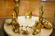 Passover Seder plate with gold-plated figures on marble base by A. Froman at Jewish Museum of Florida. Miami Beach, FL.