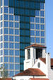 Southern Community Bank Building towers over church. Orlando, FL.