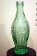 First Coke bottles bulged more than modern bottles at Coca-Cola Museum. Atlanta, GA.