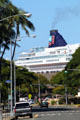 NCL Pride of America of Honolulu towers above streets of Honolulu. Honolulu, HI.