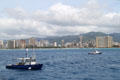 Waikiki skyline from Hilton Hawaiian Village through Sheraton Hotel seen from sea. Waikiki, HI.