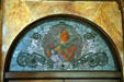 Stained glass window of woman playing violin over entrance of Auditorium Building. Chicago, IL.