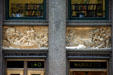 Bronze reliefs over doors of Marquette Building showing scenes of western explorations of Jacques Marquette & Louis Jolliet with quotes from their writings. Chicago, IL.