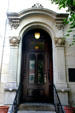 Doorway with sculpted faces. Covington, KY.