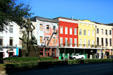 Statue of New Orleans founder Bienville against streetscape of Decatur St. New Orleans, LA.