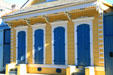 Bright yellow & blue shotgun houses. New Orleans, LA