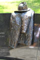 Firefighter's 1972-era coat & helmet on memorial to nine firemen killed in Vendome Hotel fire. Boston, MA.