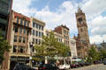 Row of commercial heritage buildings with tower of New Old South Church at end. Boston, MA.