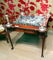 Card table from Boston, MA with English silver candlesticks at Museum of Fine Arts. Boston, MA.