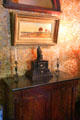 Hall sideboard with Gutenberg clock at Gibson House Museum. Boston, MA.