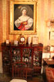 Painting over display cabinet in music room at Gibson House Museum. Boston, MA.