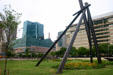 Harborplace Gallery & Inner Harbor Center Building behind I-Beam sculpture. Baltimore, MD.