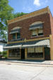 Wright Cycle Shop where Wright brothers earned money to support airplane invention, moved from Dayton, OH to Greenfield Village. Dearborn, MI.