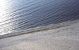 Looking down sand dune to waves of Lake Michigan in Sleeping Bear National Park. MI.