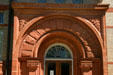 Red stone arch of Lenawee County Historical Museum. Adrian, MI.