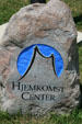 Hjemkomst Interpretive Center logo carved in stone. Moorhead, MN.